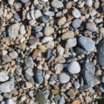 Marine mineral beauty harmony. Beach stones surface. Sea pebble texture.