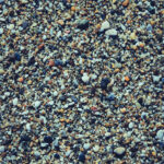 Marine mineral beauty harmony. Sea little pebble texture. Beach stones surface.