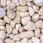 Marine mineral harmony beauty. White sea pebble cobblestones texture. Beach stones surface.