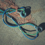 Fishnet with two buoys on rope. Nautical marine background.