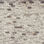 Different stone tiles background. Rocky cliff tile wall texture.