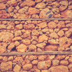 House of shell rock cobblestones layers wall texture. Coquina surface background.