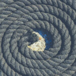 Twisted black sea rope. Nautical marine background.