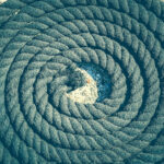 Twisted black sea rope. Nautical marine background.