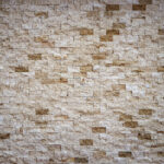 Different stone tiles background. Rocky cliff tile wall texture.