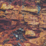 Rustic layered rock texture. Mountain pattern background.
