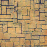 Masonry stone cladding wall texture. Geometric shapes surface background.