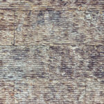 Sawn along tile pattern wall texture. Stones rock tile background.