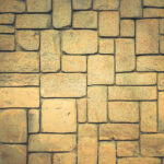 Geometric shapes surface background. Masonry stone cladding wall texture.