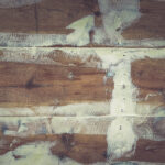 Repaired wooden ship board background. Wood planks epoxy resin repairing shipboard texture.