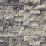 White stone interior background. Alabaster masonry cladding tiles wall texture.
