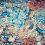 Layered rock with a rustic parts texture. Mountain pattern background.