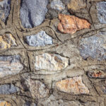 Cobblestones wall with concrete texture