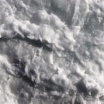 Outdoor water froth swirls backdrop. Sea wave foam texture. Marine aqua motion surface background.