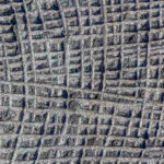 Sawn in a squares blue granite wall texture. Sawn in a squares blue granite wall texture.