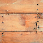 Wooden ship board with nails and screws background. Wood planks shipboard texture.