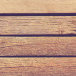 Wood planks with screws and nails texture. Wooden beach way. Wooden boards background. Horizontal direction.
