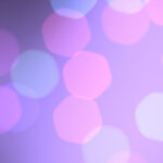 Light lilac violet bokeh background. Blurred colored texture. Happy color love creative backdrop. Bright glowing colorful pattern. Defocused sweet design.