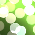 Green bokeh background. Blurred colored texture. Happy color love creative backdrop. Bright glowing colorful pattern. Defocused sweet design.