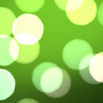 Green defocused sweet design. Bokeh background. Blurred colored texture. Happy color love creative backdrop. Bright glowing colorful pattern.