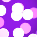 Violet defocused sweet design. Bokeh background. Blurred colored texture. Happy color love creative backdrop. Bright glowing colorful pattern.