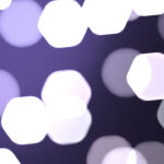 Dark purple bright glowing colorful pattern. Defocused sweet design. Bokeh background. Blurred colored texture. Happy color love creative backdrop.