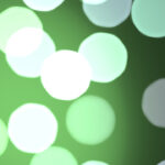 Green bright glowing colorful pattern. Defocused sweet design. Bokeh background. Blurred colored texture. Happy color love creative backdrop.