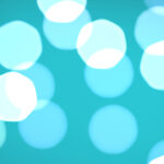 Blue bokeh background. Blurred colored texture. Happy color love creative backdrop. Bright glowing colorful pattern. Defocused sweet design.