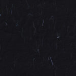 Handmade rice black paper texture with blue fibers for scrapbook.