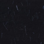 Handmade rice black paper texture with blue fibers for scrapbook.