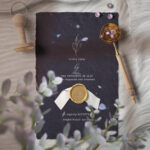 Invitation Card with Blue Petals Black Paper Textures
