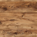 Rustic oak wooden surface with natural grain patterns and knots, showcasing warm brown tones and texture.